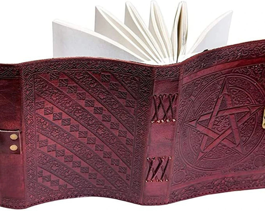 Retkatha handcrafted reddish-brown leather journal with embossed star and Celtic knotwork, featuring blank pages.