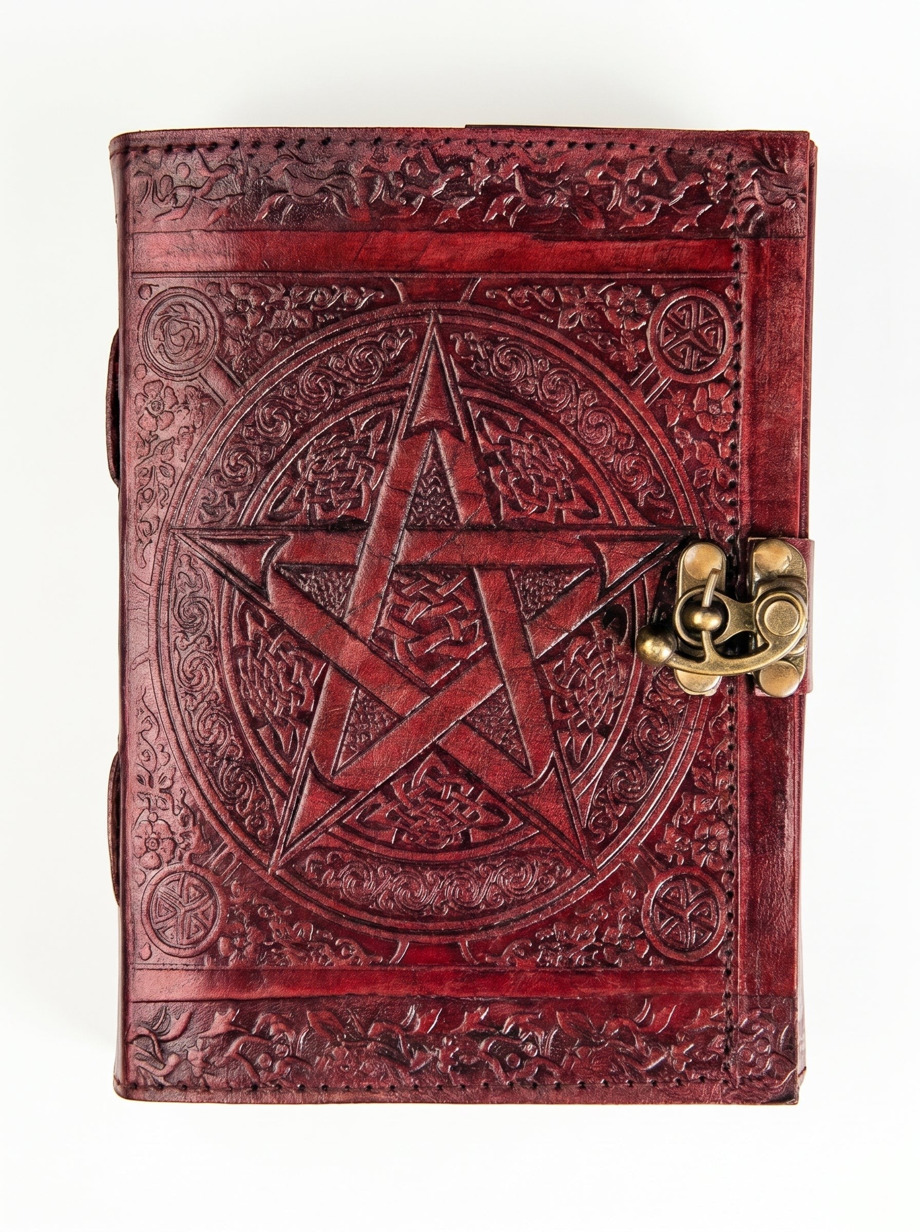 Retkatha handcrafted reddish-brown leather journal with embossed Celtic star and vintage brass metal clasp.
