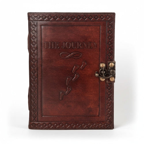 Retkatha handcrafted dark brown leather journal with embossed The Journey text, footprints, and vintage metal clasp.
