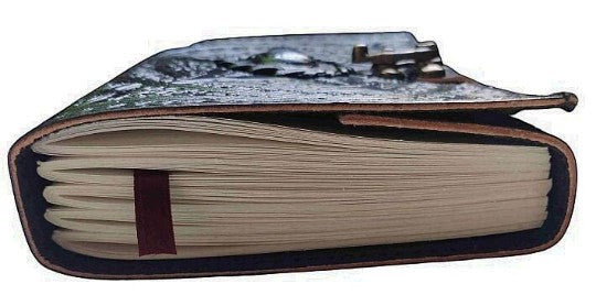 Retkatha handcrafted black leather journal with pentagram embossing, blue gemstone, and antique brass clasp closure.