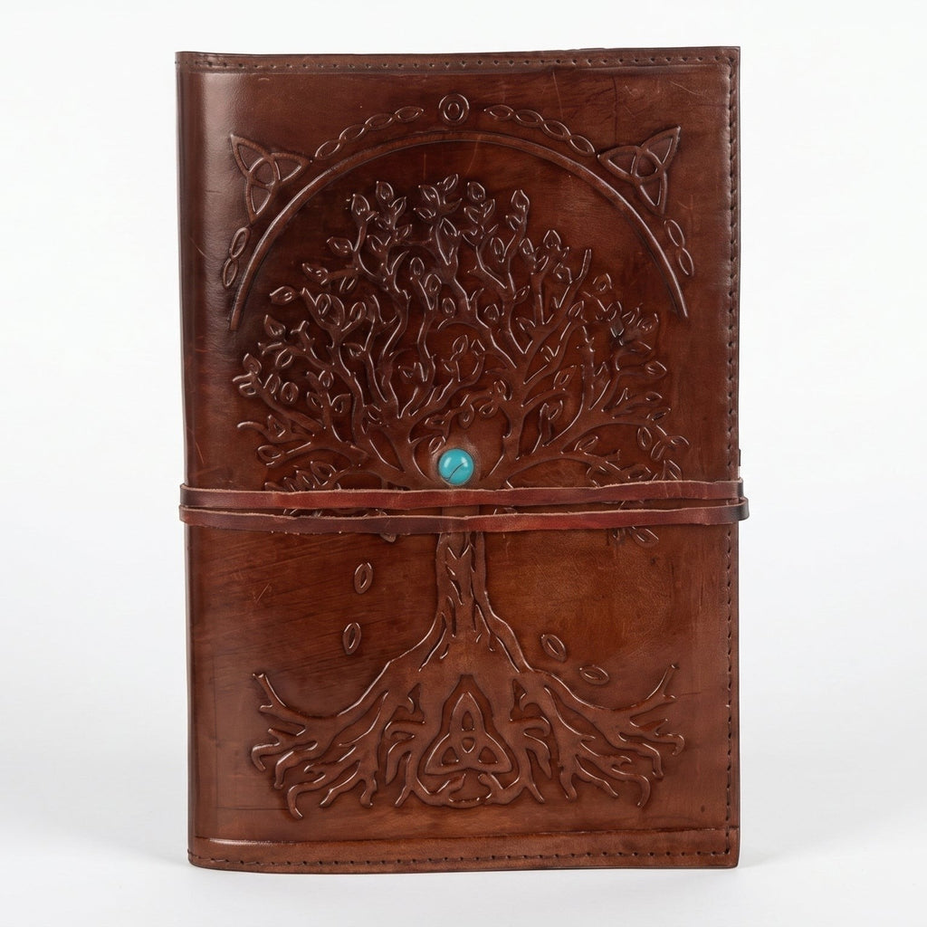 Retkatha cognac brown buffalo leather journal with embossed Tree of Life, Celtic knotwork, and turquoise stone clasp.