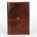 Retkatha cognac brown buffalo leather journal with embossed Tree of Life, Celtic knotwork, and turquoise stone clasp.